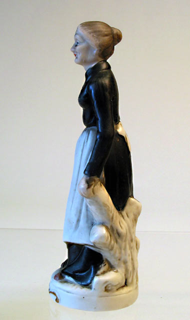 Lady in Apron Porcelain Figurine