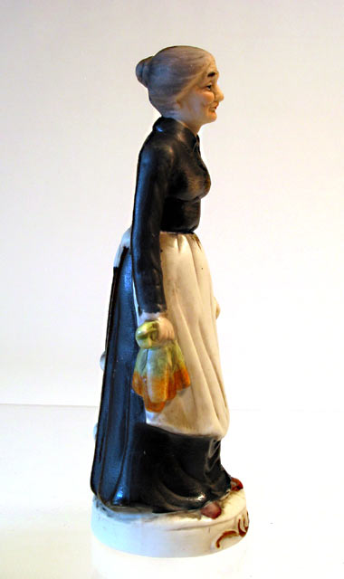 Lady in Apron Porcelain Figurine - Click Image to Close