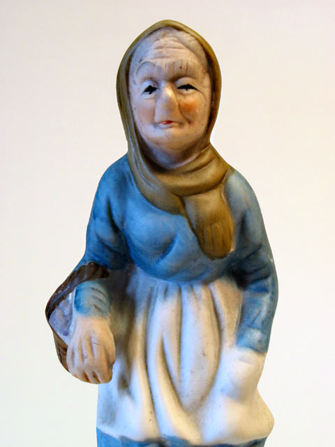 Lady with Basket Porcelain Figurine