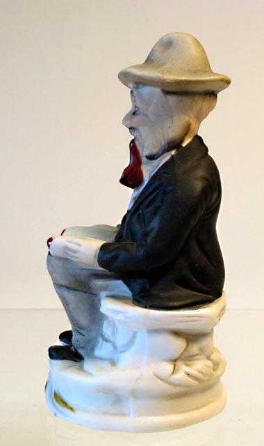 Seated Man Porcelain Figurine