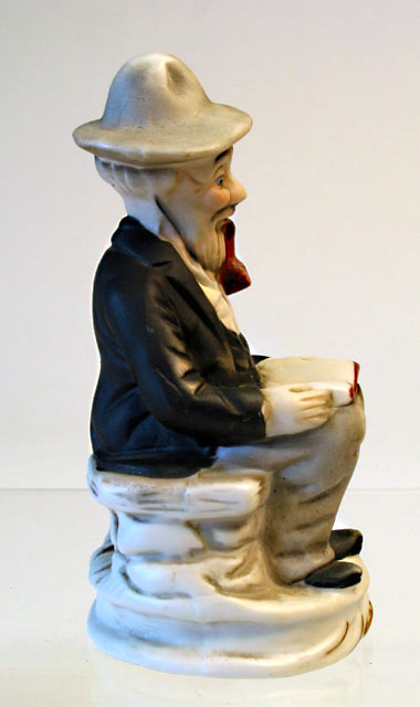 Seated Man Porcelain Figurine