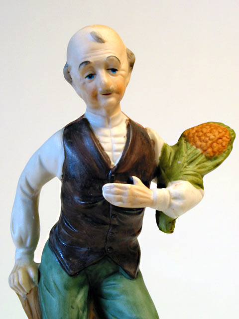 Man with Plant Porcelain Figurine - Click Image to Close