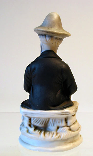 Seated Man Porcelain Figurine - Click Image to Close